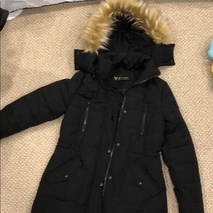 Black Guess winter jacket with fur hood.